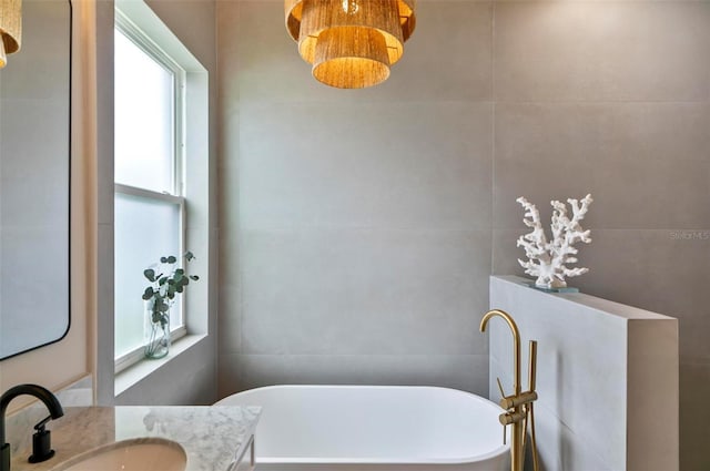56 Columbia Ln, Palm Coast, FL 32137 - bathroom with plenty of natural light, a soaking tub, and vanity