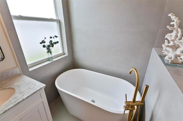 56 Columbia Ln, Palm Coast, FL 32137 - full bathroom featuring vanity and a freestanding bath