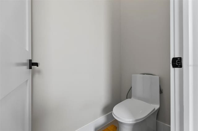56 Columbia Ln, Palm Coast, FL 32137 - bathroom featuring baseboards and toilet