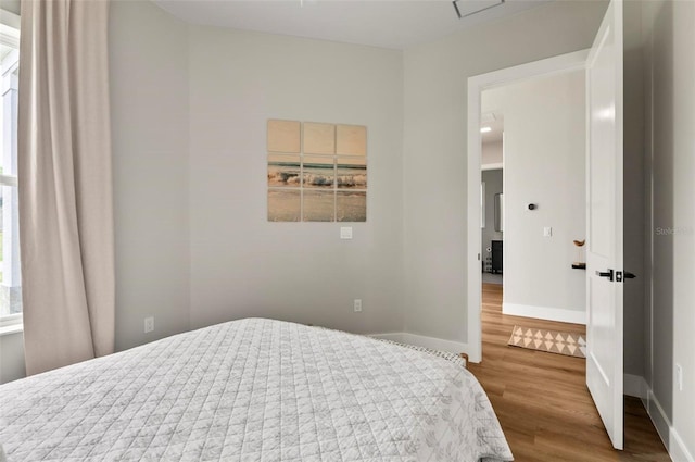56 Columbia Ln, Palm Coast, FL 32137 - bedroom with wood finished floors and baseboards