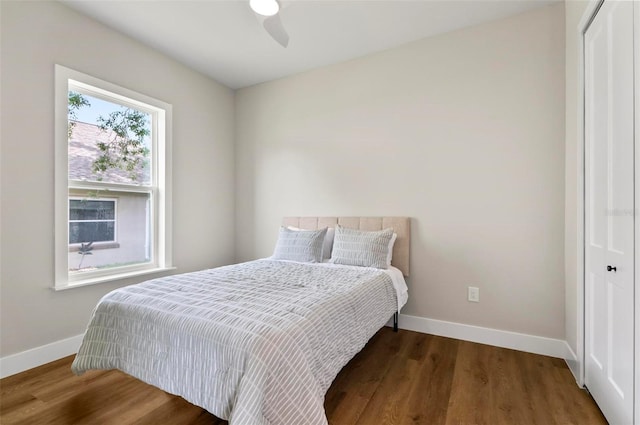 56 Columbia Ln, Palm Coast, FL 32137 - bedroom with a closet, wood finished floors, and ceiling fan