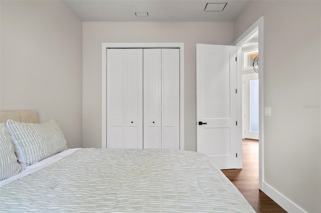 56 Columbia Ln, Palm Coast, FL 32137 - bedroom with dark wood-style floors and a closet
