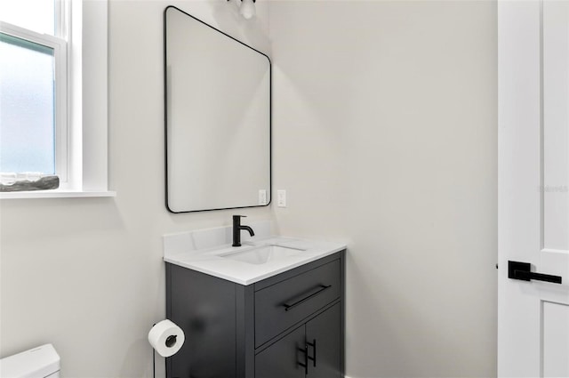 56 Columbia Ln, Palm Coast, FL 32137 - half bathroom with vanity and toilet