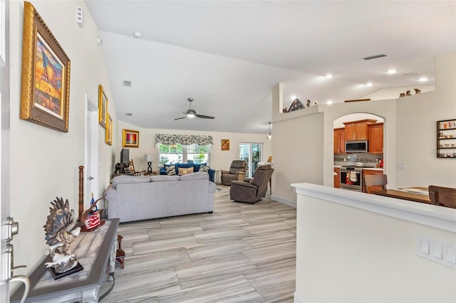 82 Ryland Dr, Palm Coast, FL 32164 - living room with a ceiling fan, lofted ceiling, and arched walkways