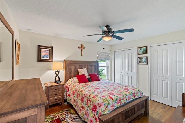 82 Ryland Dr, Palm Coast, FL 32164 - bedroom featuring two closets, wood finished floors, and ceiling fan
