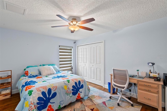 82 Ryland Dr, Palm Coast, FL 32164 - bedroom featuring a closet, a textured ceiling, wood finished floors, ceiling fan, and baseboards