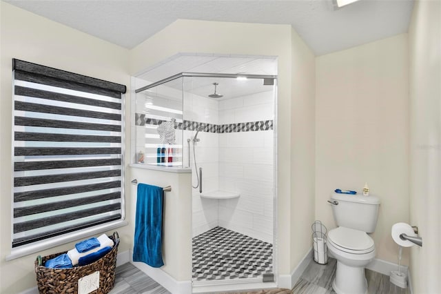 82 Ryland Dr, Palm Coast, FL 32164 - bathroom with a shower stall, toilet, and baseboards