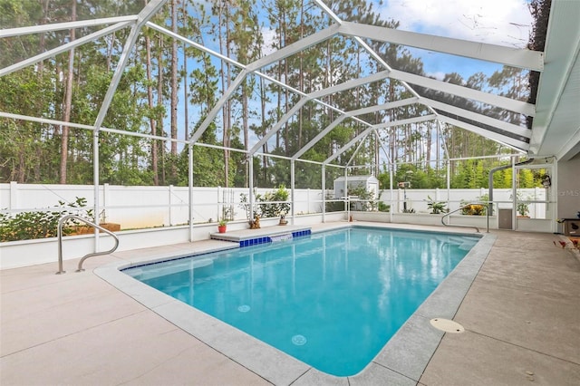 82 Ryland Dr, Palm Coast, FL 32164 - view of pool featuring a fenced backyard, a patio, and glass enclosure