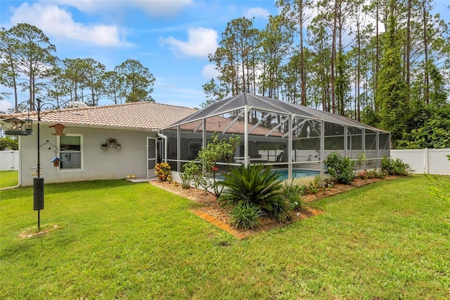 82 Ryland Dr, Palm Coast, FL 32164 - rear view of property with a tile roof, stucco siding, and a lanai