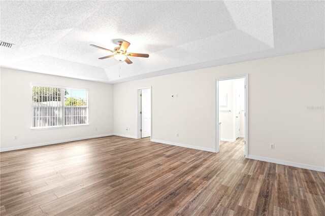 16 Flemington Ln, Palm Coast, FL 32137 - unfurnished room with ceiling fan, wood finished floors, a textured ceiling, and baseboards