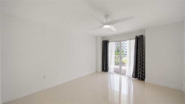 1 John Anderson Dr Unit 2180, Ormond Beach, FL 32176 - empty room featuring light tile patterned floors, baseboards, and ceiling fan