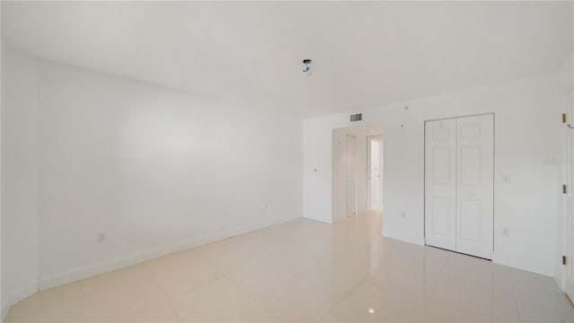 1 John Anderson Dr Unit 2180, Ormond Beach, FL 32176 - unfurnished bedroom featuring light tile patterned flooring and a closet
