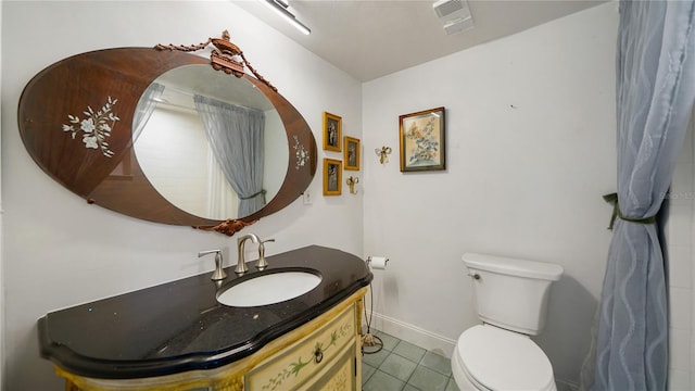 1 John Anderson Dr Unit 2180, Ormond Beach, FL 32176 - bathroom with toilet, vanity, tile patterned floors, and baseboards