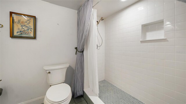 1 John Anderson Dr Unit 2180, Ormond Beach, FL 32176 - full bathroom with toilet, tiled shower, and tile patterned floors