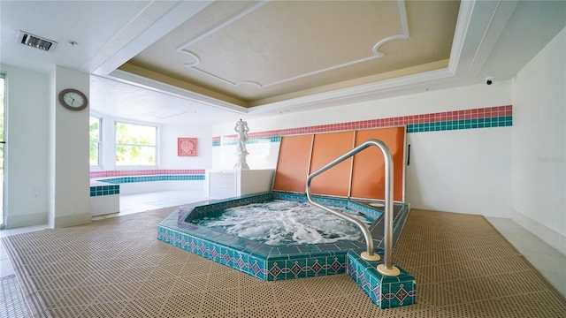 1 John Anderson Dr Unit 2180, Ormond Beach, FL 32176 - tiled bedroom with a raised ceiling and tile walls