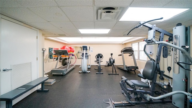 1 John Anderson Dr Unit 2180, Ormond Beach, FL 32176 - exercise room featuring a paneled ceiling and baseboards