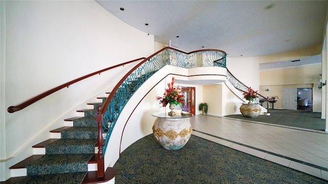 1 John Anderson Dr Unit 2180, Ormond Beach, FL 32176 - stairs featuring a high ceiling and tile patterned flooring