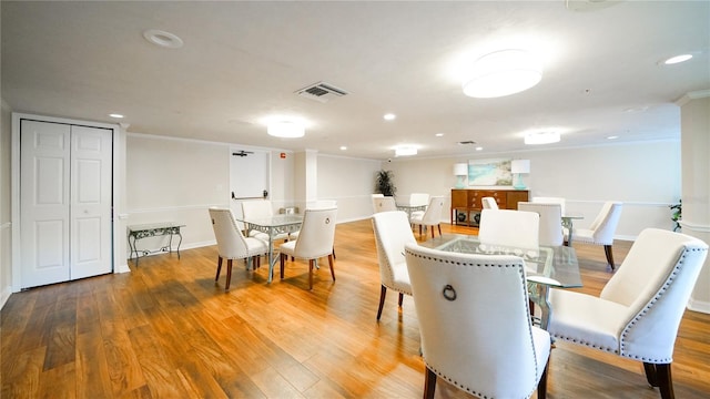 1 John Anderson Dr Unit 2180, Ormond Beach, FL 32176 - dining space with wood finished floors, recessed lighting, baseboards, and crown molding