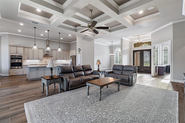 514 Wingspan Dr, Ormond Beach, FL 32174 - living area featuring dark wood-style flooring, coffered ceiling, ornamental molding, baseboards, and a ceiling fan