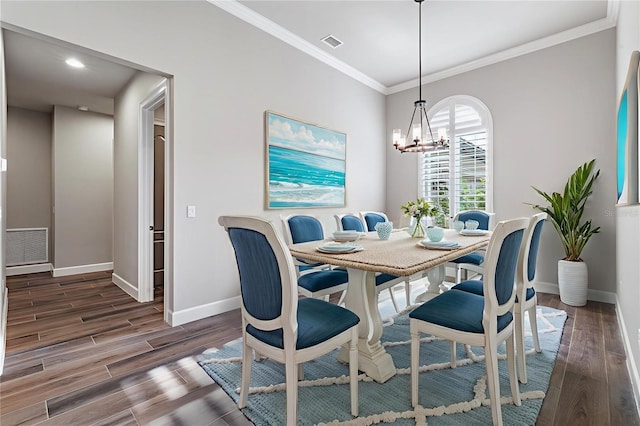 514 Wingspan Dr, Ormond Beach, FL 32174 - dining area featuring a chandelier, baseboards, wood finished floors, ornamental molding, and recessed lighting
