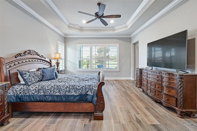 514 Wingspan Dr, Ormond Beach, FL 32174 - bedroom with a raised ceiling, light wood-style floors, ornamental molding, a ceiling fan, and baseboards