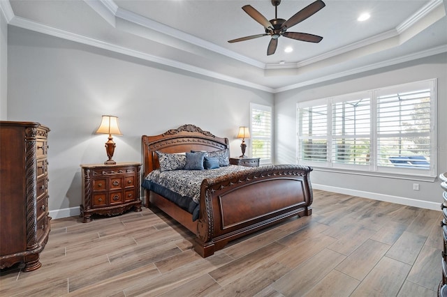 514 Wingspan Dr, Ormond Beach, FL 32174 - bedroom with a tray ceiling, light wood-style flooring, baseboards, ornamental molding, and recessed lighting