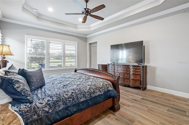 514 Wingspan Dr, Ormond Beach, FL 32174 - bedroom with a tray ceiling, wood finish floors, ornamental molding, baseboards, and recessed lighting
