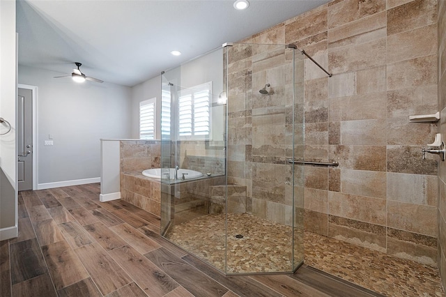 514 Wingspan Dr, Ormond Beach, FL 32174 - bathroom featuring a shower stall, a garden tub, a ceiling fan, recessed lighting, and wood finished floors