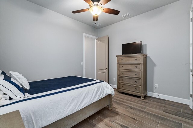 514 Wingspan Dr, Ormond Beach, FL 32174 - bedroom with wood finished floors, baseboards, and ceiling fan