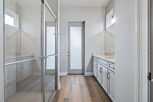 514 Wingspan Dr, Ormond Beach, FL 32174 - full bath featuring vanity, a stall shower, wood finished floors, and baseboards