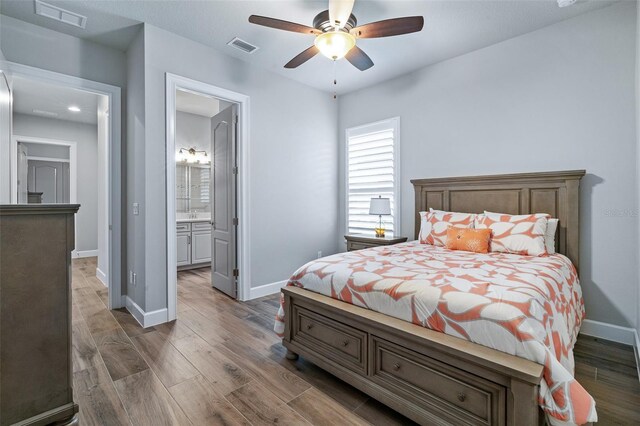 514 Wingspan Dr, Ormond Beach, FL 32174 - bedroom featuring baseboards, wood finished floors, ensuite bath, ceiling fan, and recessed lighting