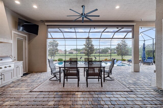 514 Wingspan Dr, Ormond Beach, FL 32174 - view of patio featuring a lanai, a ceiling fan, an outdoor pool, outdoor dining space, and a grill