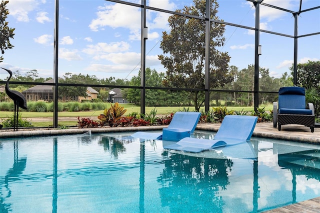 514 Wingspan Dr, Ormond Beach, FL 32174 - swimming pool with glass enclosure and a patio area