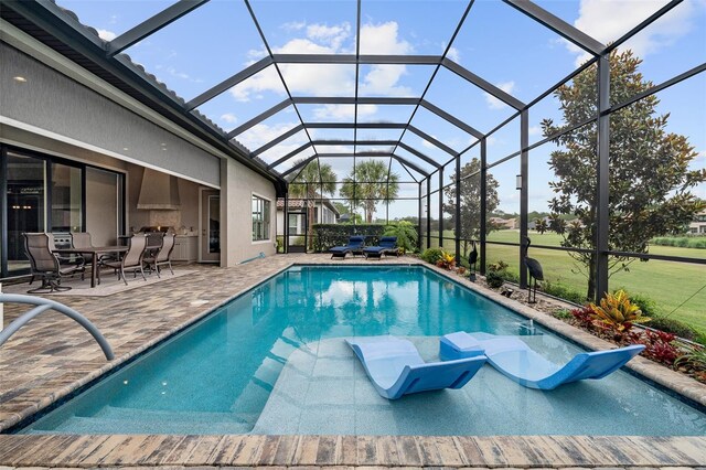 514 Wingspan Dr, Ormond Beach, FL 32174 - swimming pool with a patio area, outdoor dining area, and glass enclosure