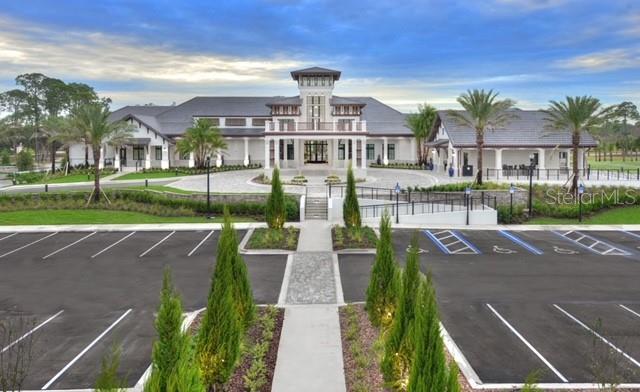 514 Wingspan Dr, Ormond Beach, FL 32174 - view of building exterior with uncovered parking