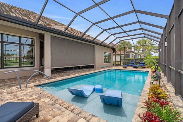 514 Wingspan Dr, Ormond Beach, FL 32174 - outdoor pool featuring a patio and glass enclosure