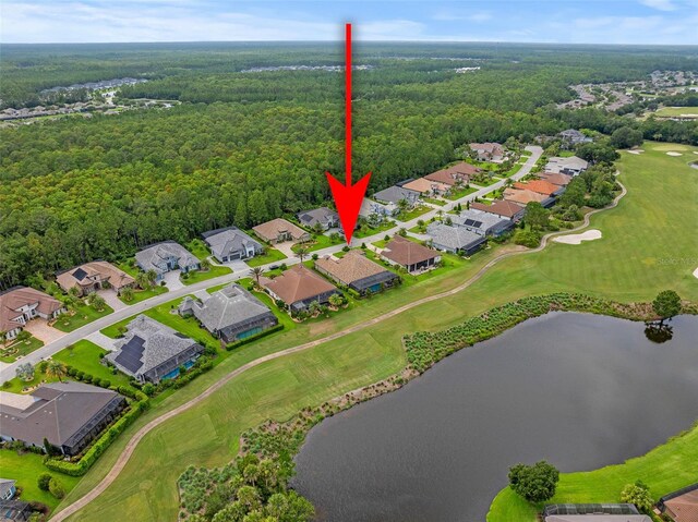 514 Wingspan Dr, Ormond Beach, FL 32174 - aerial view of residential area with a nearby body of water, a forest, and a local golf course