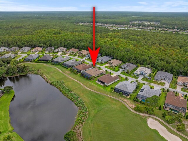 514 Wingspan Dr, Ormond Beach, FL 32174 - aerial overview of property's location with a heavily wooded area, nearby suburban area, a nearby body of water, and a local golf course