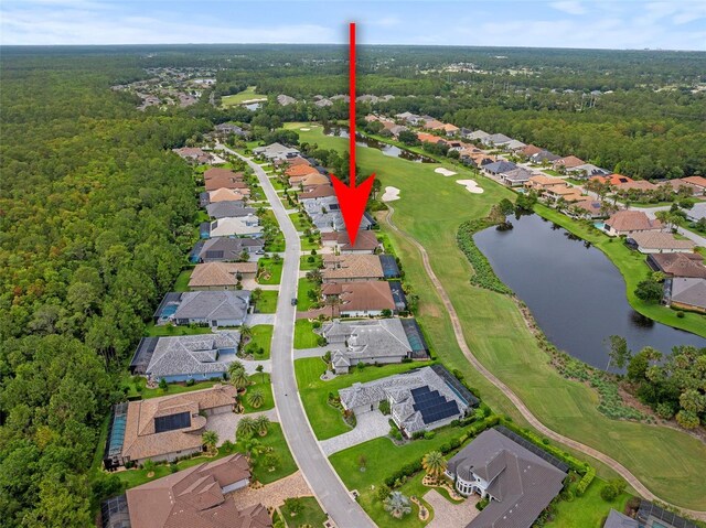 514 Wingspan Dr, Ormond Beach, FL 32174 - view of property location with nearby suburban area, a golf club, a large body of water, and a heavily wooded area