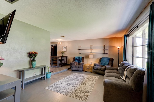 35 Whippoorwill Ln, Ormond Beach, FL 32174 - living room featuring concrete floors and a textured ceiling