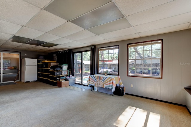 35 Whippoorwill Ln, Ormond Beach, FL 32174 - carpeted living area featuring plenty of natural light and a drop ceiling