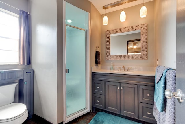 35 Whippoorwill Ln, Ormond Beach, FL 32174 - bathroom with a shower stall, vanity, toilet, and wood finished floors