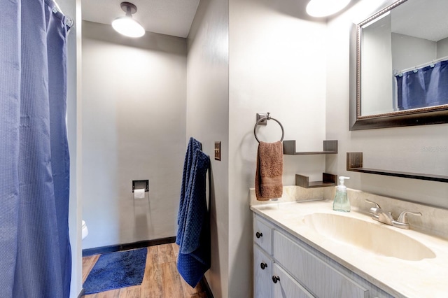 35 Whippoorwill Ln, Ormond Beach, FL 32174 - bathroom featuring vanity, wood finished floors, and baseboards