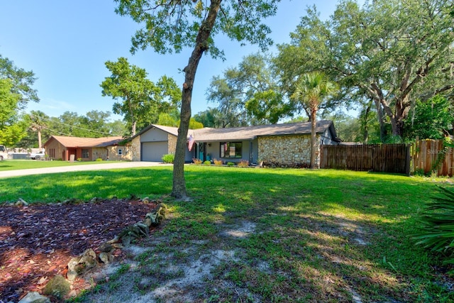 35 Whippoorwill Ln, Ormond Beach, FL 32174 - view of front of house featuring stone siding, an attached garage, and concrete driveway
