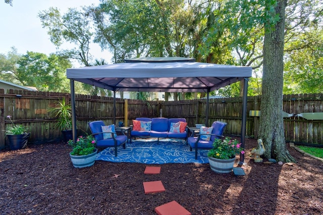 35 Whippoorwill Ln, Ormond Beach, FL 32174 - fenced backyard featuring outdoor lounge area, a gazebo, and a patio area