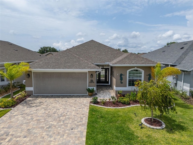 11 Tideway Trl, Palm Coast, FL 32137 - ranch-style house featuring a garage, decorative driveway, stucco siding, and roof with shingles