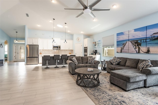 11 Tideway Trl, Palm Coast, FL 32137 - living area with vaulted ceiling, ceiling fan, recessed lighting, and arched walkways