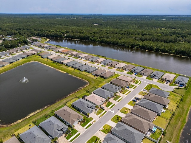 11 Tideway Trl, Palm Coast, FL 32137 - aerial perspective of suburban area featuring a forest and a nearby body of water
