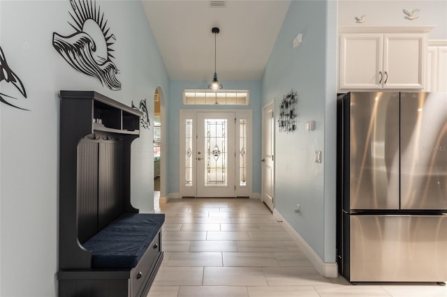 11 Tideway Trl, Palm Coast, FL 32137 - mudroom featuring arched walkways, baseboards, and high vaulted ceiling