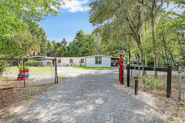 443 Polk Ave, Orange Park, FL 32065 - view of yard with gravel driveway and view of scattered trees